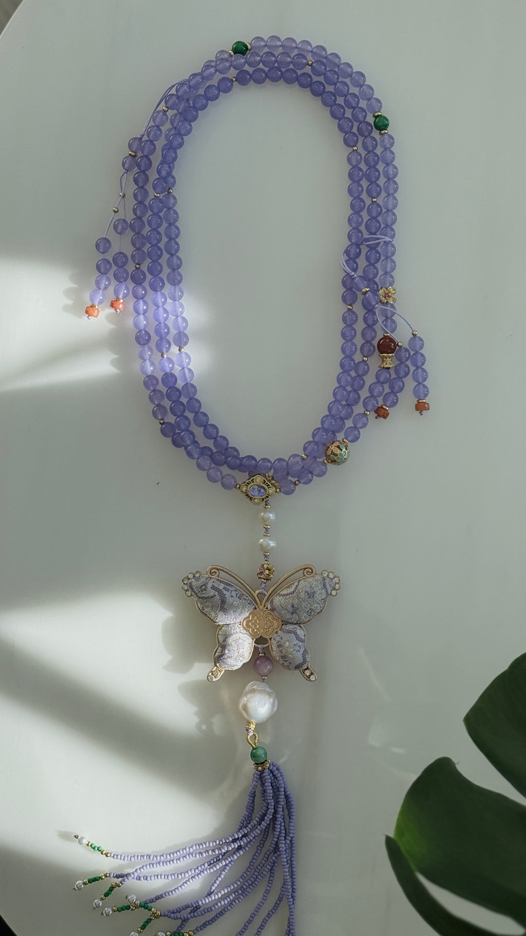 Lavender Haze · Crossbody chain with purple chalcedony beads and hand-embroidered butterfly
