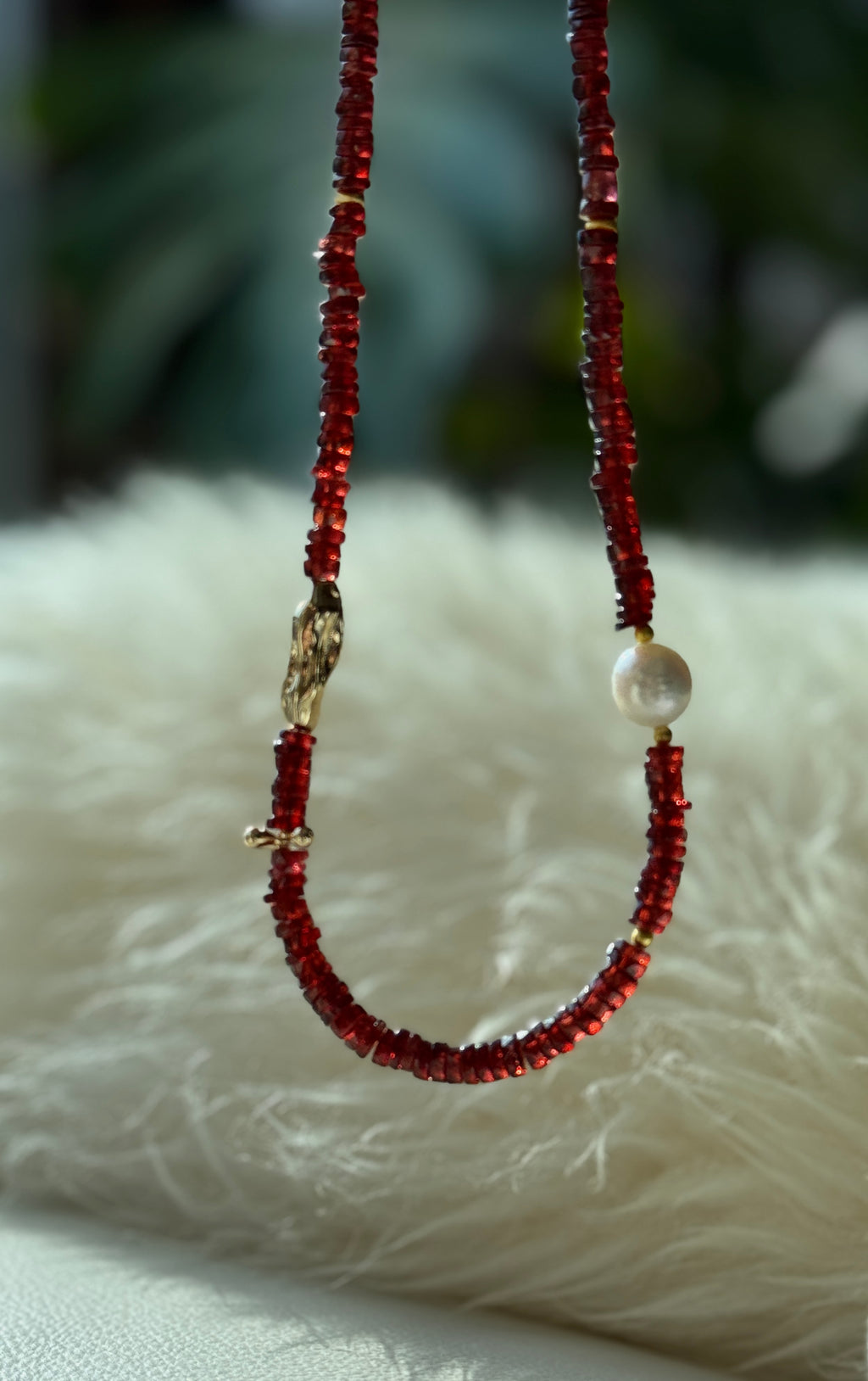 Quiet Flame · Minimalist necklace featuring natural garnet beads