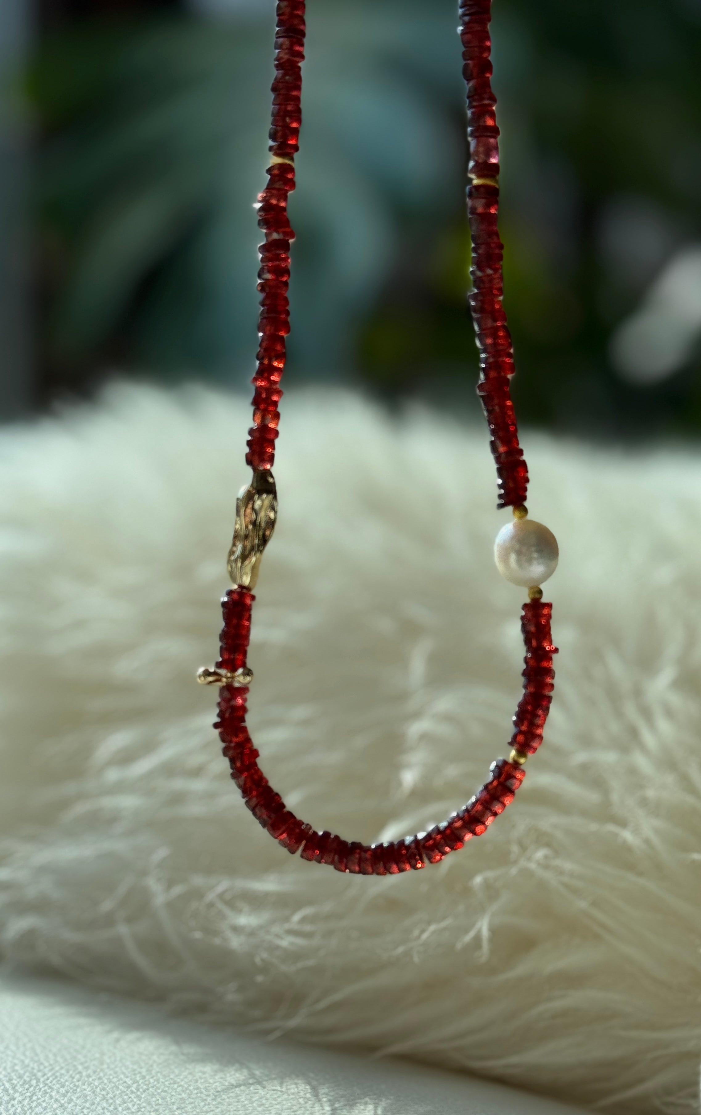 Quiet Flame · Minimalist necklace featuring natural garnet beads