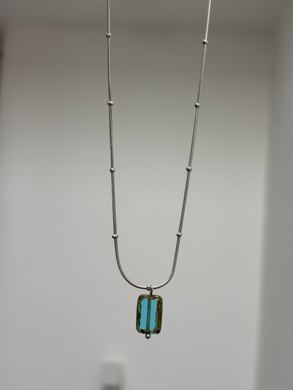 Glacierine · Necklace draws inspiration from the stillness of cold water and mineral light