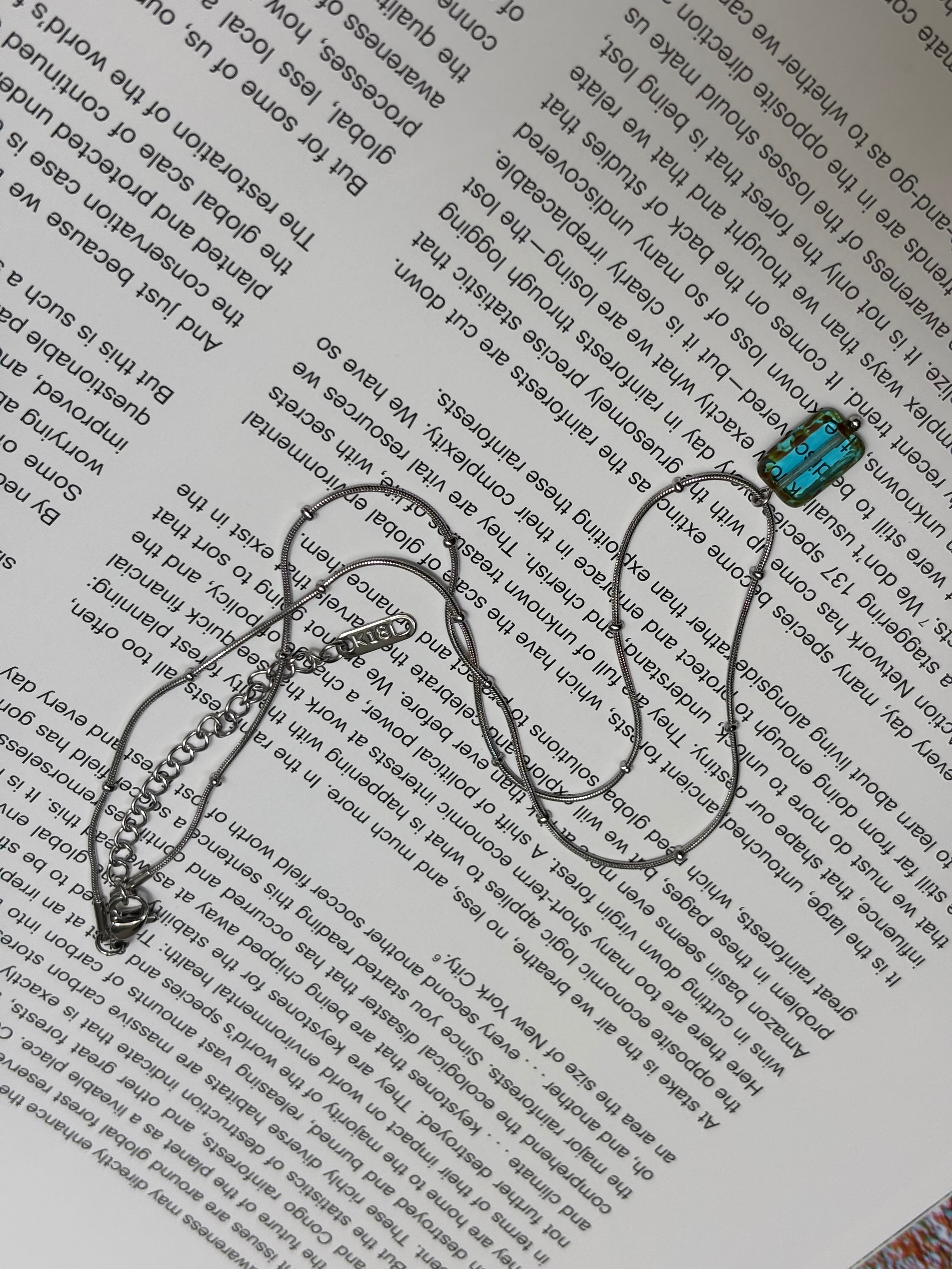 Glacierine · Necklace draws inspiration from the stillness of cold water and mineral light