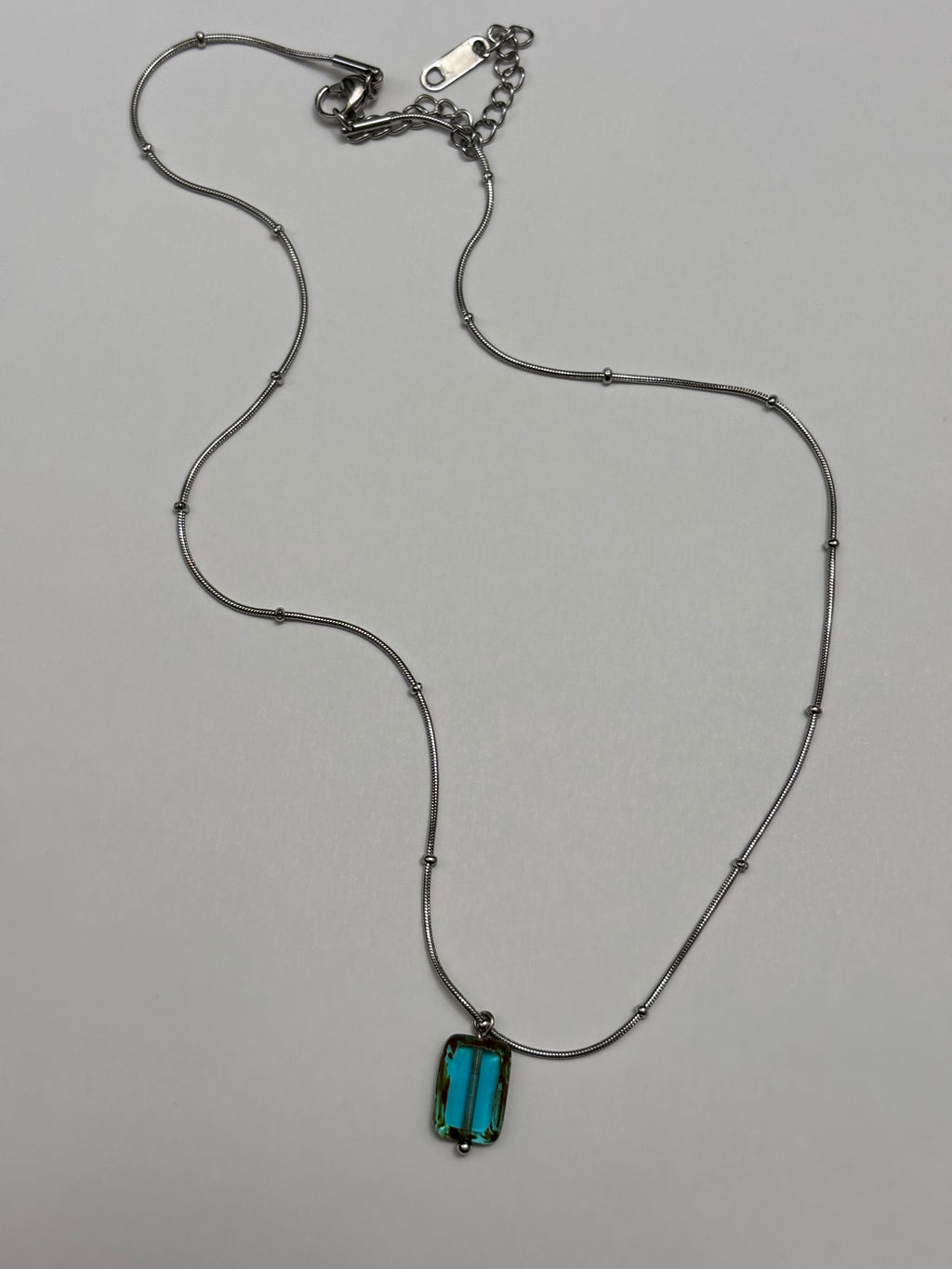 Glacierine · Necklace draws inspiration from the stillness of cold water and mineral light