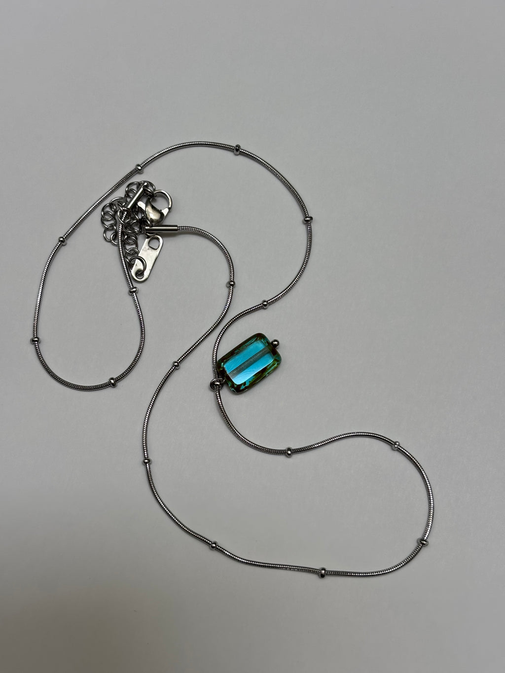 Glacierine · Necklace draws inspiration from the stillness of cold water and mineral light