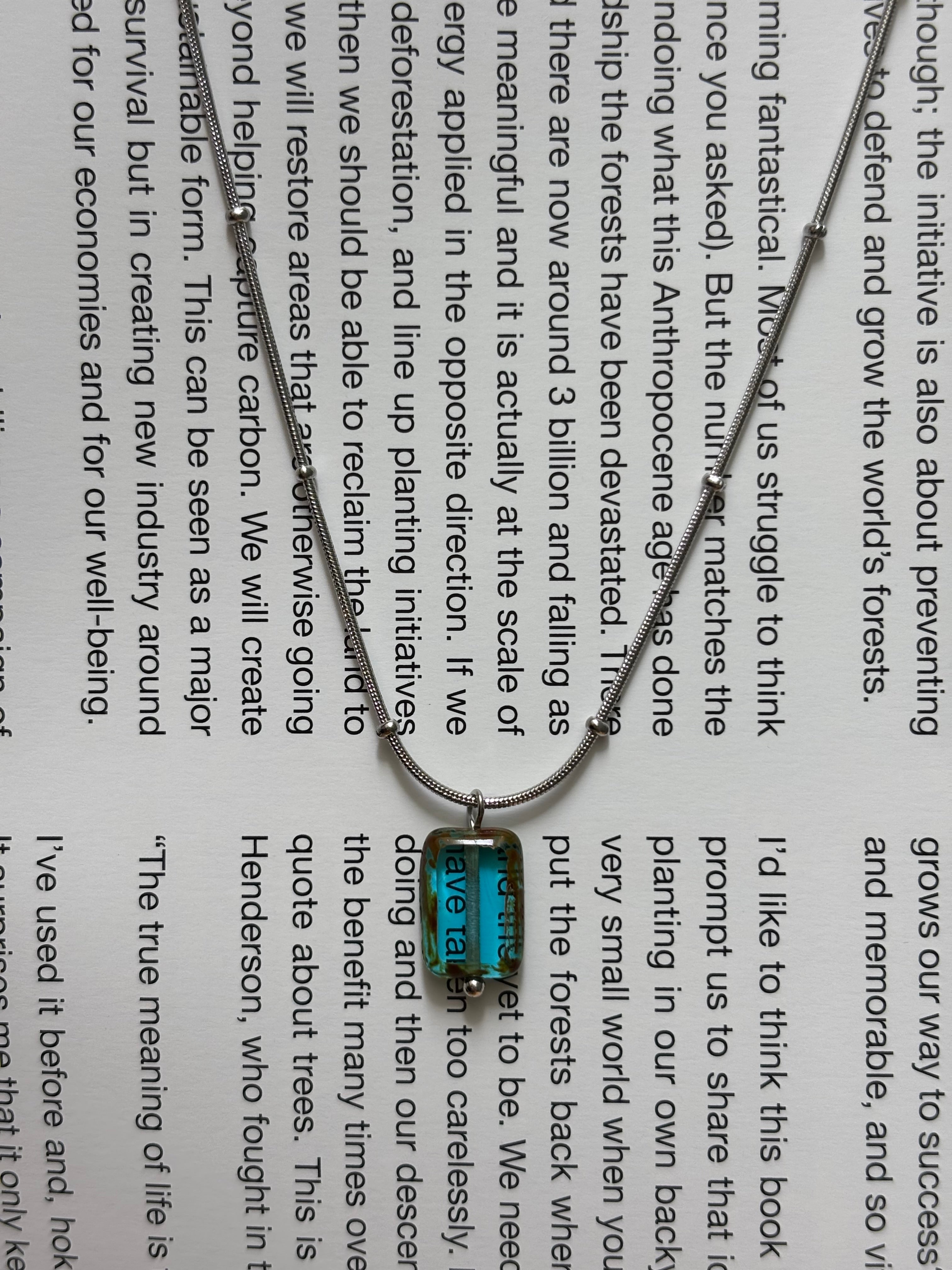 Glacierine · Necklace draws inspiration from the stillness of cold water and mineral light