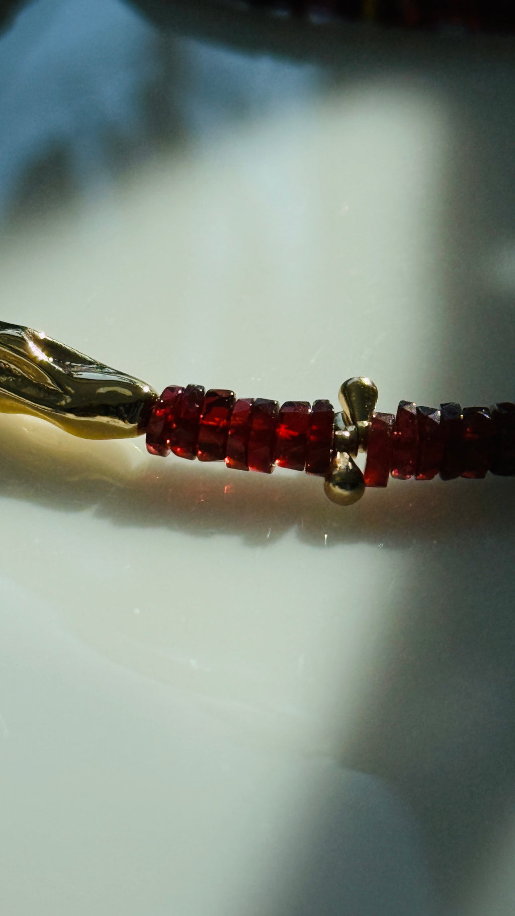 Quiet Flame · Minimalist necklace featuring natural garnet beads